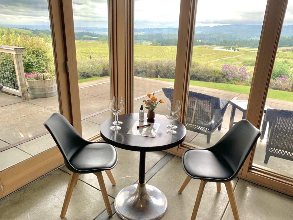 A table is set for a tasting for two overlooking the vineyards at Bethel Heights.