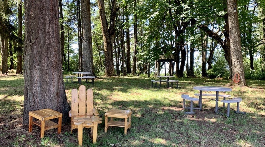 A forested picnic area for tasting at Redhawk Vineyards